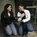 Sady Lima, left, and Cecilia Martinez, right, hug a puppy which has been put up for adoption at the Stockton Animal Shelter in Stockton, Calif., Wednesday, Jan. 16, 2008. In the heart of foreclosure country, abandoned animals are becoming a given, much like destroyed houses and fallen neighborhoods. In Stockton, Modesto and other nearby cities with some of the highest foreclosure rates in the nation, animal shelters and rescue groups are inundated. (AP Photo/Marcio Jose Sanchez)