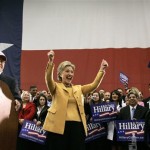 Rep. Ruben Hinojosa, D-Texas, left, introduces Democratic presidential hopeful, Sen. Hillary Rodham Clinton, D-N.Y., as she reacts during a campaign stop at the McAllen Convention Center in McAllen, Texas, Wednesday, Feb. 13, 2008. (AP Photo/Carolyn Kaster)
