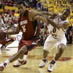 Stanford forward Lawrence Hill, left, is fouled by Arizona State guard Jamelle McMillan, right, as Hill drives to the basket in the first half of an NCAA basketball game Thursday, Feb. 14, 2008, in Tempe, Ariz.(AP Photo/Paul Connors)