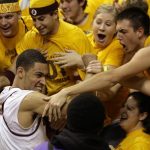 Arizona State forward Jeff Pendergraph, front, is congratulated by fans at the conclusion of an NCAA basketball game against Stanford on Thursday, Feb. 14, 2008, in Tempe, Ariz. Arizona State won 72-68 in overtime.(AP Photo/Paul Connors)