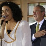 2007 American Idol winner Jordin Sparks sings the Star Spangled Banner during a visit by President Bush to the U.S. ambassador's residence in Accra, Ghana, Wednesday, Feb. 20, 2008. Sparks is working with "Malaria No More" a non-profit organization dedicated to combating Malaria in Africa. (AP Photo/Charles Dharapak)
