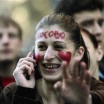 A girl with the word "Kosovo" written on her face in Serbian cyrillic letters attends a rally against Kosovo's independence in Belgrade, Serbia, Thursday, Feb. 21, 2008. At least 150,000 Serbs gathered in central Belgrade on Thursday in a massive protest against Kosovo's declaration of independence, raising fears of street violence. (AP Photo/Marko Drobnjakovic)