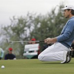 Aaron Baddeley, of Australia, falls to his knees as he misses a putt on the 19th hole in a third-round match against Tiger Woods in the Accenture Match Play Championship golf tournament at The Gallery Golf Club at Dove Mountain in Marana, Ariz., Friday. Woods won the match on the 20th hole.