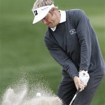 Stuart Appleby, of Australia, hits out of a bunker onto the third green during the third round of the Accenture Match Play Golf Championship tournament at The Gallery Golf Club at Dove Mountain, in Marana, Ariz., Friday.