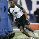 Defensive lineman Calais Campbell of Miami runs a drill at the NFL Combine in Indianapolis, Monday, Feb. 25, 2008. (AP Photo/Michael Conroy)