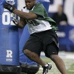 Defensive lineman Dre Moore of Maryland runs a drill at the NFL Combine in Indianapolis, Monday, Feb. 25, 2008. (AP Photo/Michael Conroy)