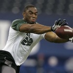 Defensive lineman Vernon Gholston of Ohio State makes a catch as he runs a drill at the NFL Combine in Indianapolis, Monday, Feb. 25, 2008. (AP Photo/Michael Conroy