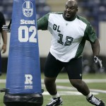Defensive lineman Sedrick Ellis of Southern California hits a blocking dummy as he runs a drill at the NFL Combine in Indianapolis, Monday, Feb. 25, 2008. (AP Photo/Michael Conroy)