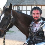 A knight tends to his injuries after the joust. (James Webb/KTAR)