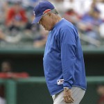 Chicago Cubs manager Lou Piniella walks back to the dugout after a conference on the pitchers mound during the eighth inning of a spring training baseball game against the Arizona Diamondbacks, Wednesday, March 5, 2008 in Tucson, Ariz. The Diamondbacks defeated the Cubs 5-4.(AP Photo/M. Spencer Green)