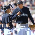 Seattle Mariners catcher Kenji Johjima, left, of Japan, talks to pitcher Phillippe Aumont during the fourth inning of a spring training baseball game against the Arizona Diamondbacks on Sunday, March 9, 2008, in Tucson, Ariz. (AP Photo/Nam Y. Huh)