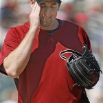 Arizona Diamondbacks starting pitcher Brandon Webb reacts after Seattle Mariners' Greg Norton hit a double during the first inning of a spring training baseball game on Sunday, March 9, 2008, in Tucson, Ariz. The Mariners won, 10-7. (AP Photo/Nam Y. Huh)
