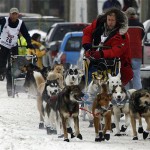 Canadian musher Sebastian Schnuelle, front, races Zack Steer, of Sheep Mountain, Alaska, up Front Street in Nome, Alaska, Wednesday, March 12, 2008, towards the finish of the Iditarod Trail Sled Dog Race. Schnuelle finished 10th, and Steer finished 11th. (AP Photo/Al Grillo)