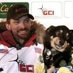 Lance Mackey sits with one of his dogs, Handsome, after winning the Iditarod Trail Sled Dog Race in Nome, Alaska early Wednesday March 12, 2008. Mackey won his second consecutive Iditarod, completing the 1,100-mile journey across Alaska in just under nine and a half days. (AP Photo/Al Grillo)