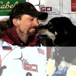Lance Mackey gets a kiss from one of his dogs, Handsome, after winning the Iditarod Trail Sled Dog Race early Wednesday March 12, 2008 in Nome, Alaska. (AP Photo/Al Grillo)
