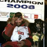 Lance Mackey sits with one of his dogs, Handsome, after winning the Iditarod Trail Sled Dog Race early Wednesday March 12, 2008 in Nome, Alaska. (AP Photo/Al Grillo)
