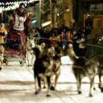 Lance Mackey drives his team to the finish line of the Iditarod Trail Sled Dog Race in Nome, Alaska early Wednesday March 12, 2007. Mackey won his second consecutive Iditarod Trail Sled Dog Race, completing the 1,100-mile journey across Alaska in just under nine and a half days. (AP Photo/Al Grillo)
