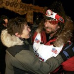 Lance Mackey is greeted by his mother, Kathie Smith, at the finish line of the Iditarod Trail Sled Dog Race in Nome, Alaska, early Wednesday March 12, 2008. Mackey won his second consecutive Iditarod, completing the 1,100-mile journey across Alaska in just under nine and a half days. (AP Photo/Al Grillo)
