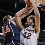 Stanford's Robin Lopez, right, scores a basket against Arizona's Bret Brielmaier during the second half of their quarterfinals basketball game at the Pac-10 men's college basketball tournament at the Staples Center in Los Angeles Thursday, March 13, 2008. Lopez finished with 14 points and Stanford defeated Arizona 75-64. (AP Photo/Kevork Djansezian)