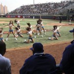 Los Angeles Dodgers' Andruw Jones, left, and and two unidentified players watch cheerleaders perform during an exhibition baseball game against the San Diego Padres, Sunday, March 16, 2008, in Beijing, China. (AP Photo/Robert F. Bukaty)