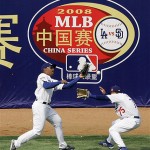 Los Angeles Dodgers outfielders George Lombard, left, and Paul Xavier, miss play a hit by San Diego Padres' Kevin Kouzmanoff during an exhibition baseball game, Sunday, March 16, 2008, in Beijing, China. (AP Photo/Robert F. Bukaty)