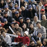 Chinese fans watch an exhibition game between the Los Angeles Dodgers and the San Diego Padres, Sunday, March 16, 2008, in Beijing, China. (AP Photo/Robert F. Bukaty)