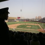 A Beijing police officer keeps watch during an exhibition game between the Los Angeles Dodgers and the San Diego Padres, Sunday, March 16, 2008, in Beijing, China. (AP Photo/Robert F. Bukaty)