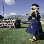 The San Diego Padres's mascot, Swinging Friar, watches at the teams poses for a group photo before an exhibition game against the Los Angeles Dodgers, Saturday, March 15, 2008, in Beijing, China. (AP Photo/Robert F. Bukaty)
