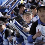 Young Chinese baseball fans attend at an exhibition game between the Los Angeles Dodgers and San Diego Padres, Saturday, March 15, 2008, in Beijing, China.(AP Photo/Robert F. Bukaty)
