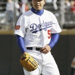 Los Angeles Dodgers pitcher Hong-Chih Kuo of Taiwan leaves the field after pitching in an exhibition game against the San Diego Padres Saturday, March 15, 2008, in Beijing, China. (AP Photo/Robert F. Bukaty)