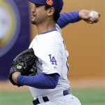 Los Angeles Dodgers pitcher Chan Ho Park, of South Korea, pitches in the first inning of an exhibition game against the San Diego Padres, Saturday, March 15, 2008, in Beijing, China. (AP Photo/Robert F. Bukaty)