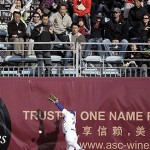 Chinese fans watch as Los Angeles Dodgers right fielder Paul Xavier misses a ball hit by San Diego Padres' Adrian Gonzalez during an exhibition baseball game, Saturday, March 15, 2008, in Beijing, China. (AP Photo/Robert F. Bukaty)