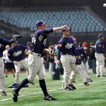 San Diego Padres' baseball team players warm up during a training at Wukesong Baseball Stadium in Beijing, China, Friday, March 14, 2008. The Los Angeles Dodgers will play the San Diego Padres on Saturday and Sunday. Wukesong Baseball Field will be used for the 2008 Beijing Olympics. (AP Photo/Andy Wong)