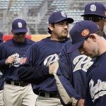 San Diego Padres' first basemen Adrian Gonzalez warms up with his teammates during a training session at Wukesong Baseball Stadium in Beijing, China, Friday, March 14, 2008. The Los Angeles Dodgers will play the San Diego Padres on Saturday and Sunday. Wukesong Baseball Field will be used for the 2008 Beijing Olympics. (AP Photo/Andy Wong)