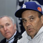 Los Angeles Dodgers manager Joe Torre, right, speaks, at a news conference, Friday, March 14, 2008, in Beijing, China. Team owner Frank McCourt looks on at left. The Dodgers will play the San Diego Padres in an exhibition series this weekend. (AP Photo/Robert F. Bukaty)