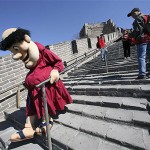 Swinging Friar, the San Diego Padres baseball team's mascot, carefully makes his way down a steep incline while climbing the Great Wall, Thursday, March 13, 2008, near Beijing, China. The Padres play the Los Angeles Dodgers in an exhibition series this weekend in Beijing. (AP Photo/Robert F. Bukaty)