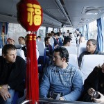 San Diego Padres's Adrian Gonzalez, center, sits with his teammates inside a bus heading to Great Wall in Beijing, China, Thursday, March 13, 2008. The Los Angeles Dodgers will play the San Diego Padres on Saturday and Sunday. (AP Photo/Andy Wong)