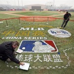 Groundskeepers Murray Cook, left, and Chad Olsen, paint the logo for this weekend's Major League Baseball series at Wukesong Baseball Field in Beijing, China, Wednesday, March 12, 2008. The Los Angeles Dodgers will play the San Diego Padres on Saturday and Sunday. Wukesong Baseball Field will be used for the 2008 Beijing Olympics. (AP Photo/Robert F. Bukaty)