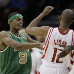 Boston Celtics' Rajon Rondo (9) pushes Houston Rockets' Rafer Alston (12) during the first quarter of a basketball game Tuesday, March 18, 2008, in Houston. (AP Photo/David J. Phillip)