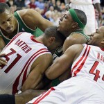 Houston Rockets' Chuck Hayes (44) and Shane Battier (31) battle Boston Celtics' Paul Pierce, center, and P.J. Brown, left, for a loose ball during the second quarter of a basketball game Tuesday, March 18, 2008, in Houston. (AP Photo/David J. Phillip)