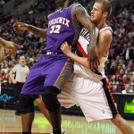 Phoenix Suns Shaquille O'Neal (32) leans on Portland Trail Blazers Joel Przybilla in the first quarter of their NBA basketball game Tuesday, March 18, 2008, in Portland, Ore. (AP Photo/Rick Bowmer)

