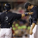 Seattle Mariners catcher Kenji Johjima, left, of Japan, consoles pitcher Ryan Rowland-Smith after being taken out of the game against the Arizona Diamondbacks in the fifth inning of a spring training baseball game in Peoria, Ariz., Wednesday, March 19, 2008. (AP Photo/Chris Carlson)