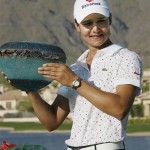 Lorena Ochoa, of Mexico, smiles as she holds up the winner's trophy after the final round of the LPGA Safeway International golf tournament at Superstition Mountain Golf and Country Club Sunday, March 30, 2008, in Superstition Mountain, Ariz. Ochoa won the tournament at 22-under par, winning by seven strokes. (AP Photo/Ross D. Franklin)