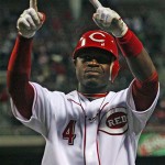 Cincinnati Reds' Brandon Phillips points to the stands after hitting a two-run home run off Arizona Diamondbacks pitcher Dan Haren in the fourth inning of a baseball game, Wednesday, April 2, 2008, in Cincinnati. (AP Photo/Tom Uhlman)