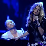 Fergie performs with John Legend, left, at the "Idol Gives Back" fundraising special of "American Idol" in Los Angeles on Sunday April 6, 2008. (AP Photo/Mark J. Terrill)