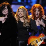 Fergie, center, is seen on stage with sisters Ann, left, and Nancy Wilson, of Heart, at the "Idol Gives Back" fundraising special of "American Idol" in Los Angeles on Sunday April 6, 2008. (AP Photo/Mark J. Terrill)
