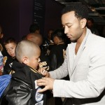 John Legend, right, signs autographs backstage at the "Idol Gives Back" fundraising special of "American Idol" in Los Angeles on Sunday April 6, 2008. (AP Photo/Mark J. Terrill)