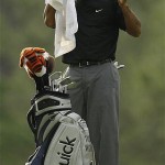 Tiger Woods wipes his face in the 14th fairway during the second round of the 2008 Masters golf tournament at the Augusta National Golf Club in Augusta, Ga., Friday.