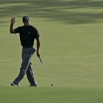 Tiger Woods waves to patrons after saving par on the 11th hole during the second round of the 2008 Masters golf tournament at the Augusta National Golf Club in Augusta, Ga., Friday.