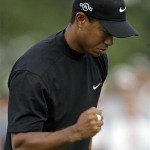 Tiger Woods pumps his fist after saving par on the 18th hole during the second round of the 2008 Masters golf tournament at the Augusta National Golf Club in Augusta, Ga., Friday.
